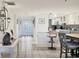 Inviting foyer leading to an open kitchen and dining area, creating a seamless transition between spaces at 1065 Gulf Of Mexico Dr # 103, Longboat Key, FL 34228