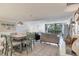 Inviting living area featuring a modern dining set and comfortable seating with exterior views at 1065 Gulf Of Mexico Dr # 103, Longboat Key, FL 34228