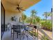 Inviting patio featuring a ceiling fan and views of lush landscaping at 1065 Gulf Of Mexico Dr # 103, Longboat Key, FL 34228