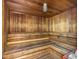 A wooden sauna with wooden benches and a classic sauna heater at 1065 Gulf Of Mexico Dr # 103, Longboat Key, FL 34228