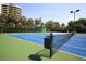 Enjoy a friendly tennis match on the community tennis court, surrounded by mature landscaping at 1065 Gulf Of Mexico Dr # 103, Longboat Key, FL 34228