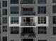Condo balcony with glass railings and outdoor seating, offering serene city views at 111 S Pineapple Ave # 716, Sarasota, FL 34236