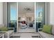 View from the spacious balcony of the living area with sliding glass doors to the home's interior at 111 S Pineapple Ave # 716, Sarasota, FL 34236