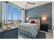 Cozy bedroom featuring a ceiling fan and a large window at 111 S Pineapple Ave # 716, Sarasota, FL 34236
