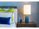 Well-appointed bedside table featuring a stylish lamp and convenient charging station at 111 S Pineapple Ave # 716, Sarasota, FL 34236