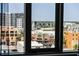 Bright city view with commercial and residential buildings, seen through a large window at 111 S Pineapple Ave # 716, Sarasota, FL 34236