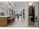 The open-concept living space features a kitchen island, and powder room, bathed in natural light at 111 S Pineapple Ave # 716, Sarasota, FL 34236