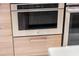 The kitchen boasts a stainless steel oven with sleek cabinetry and modern hardware at 111 S Pineapple Ave # 716, Sarasota, FL 34236