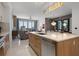 Open concept kitchen with an island, modern appliances, and seamless access to the living area and views at 111 S Pineapple Ave # 716, Sarasota, FL 34236