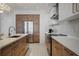 Well-appointed kitchen with stainless appliances, custom cabinets and large center island at 111 S Pineapple Ave # 716, Sarasota, FL 34236