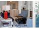 Stylish living room with a partial view of a modern kitchen and balcony access at 111 S Pineapple Ave # 716, Sarasota, FL 34236
