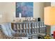 Tastefully decorated living room featuring unique buffet with art and modern armchair at 111 S Pineapple Ave # 716, Sarasota, FL 34236