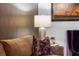 Cozy living room showcasing a comfortable sofa, decorative pillows, a side table, and elegant artwork at 111 S Pineapple Ave # 716, Sarasota, FL 34236