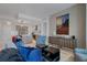Open-concept living room with modern decor, including stylish furniture and art, with partial kitchen view at 111 S Pineapple Ave # 716, Sarasota, FL 34236