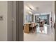Bright, open-concept living space with barstool seating, marble floors, and floor-to-ceiling windows at 111 S Pineapple Ave # 716, Sarasota, FL 34236
