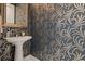 The Powder Room's designer wallpaper gives this small space a stylish and modern touch at 111 S Pineapple Ave # 716, Sarasota, FL 34236