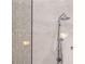 Contemporary shower with marble tile and a modern showerhead fixture at 111 S Pineapple Ave # 716, Sarasota, FL 34236