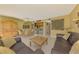 Open-concept living space with dining area, comfortable seating, and plenty of natural light at 1200 Cove Ii Pl # 832, Sarasota, FL 34242