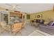 Inviting living room and dining area with comfortable seating and stylish decor in warm, neutral tones at 1200 Cove Ii Pl # 832, Sarasota, FL 34242