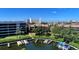 Picturesque marina view with boats docked alongside lush landscaping, highlighting waterfront living at 1200 Cove Ii Pl # 832, Sarasota, FL 34242