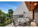 Outdoor patio area with table and chairs, and outdoor drying rack at 1200 Cove Ii Pl # 832, Sarasota, FL 34242