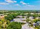 Gorgeous aerial view of a sprawling neighborhood, emphasizing the lush greenery and scenic surroundings at 12311 Newcastle Pl, Lakewood Ranch, FL 34202