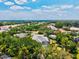An aerial view of a home surrounded by lush greenery, showcasing the serene neighborhood setting at 12311 Newcastle Pl, Lakewood Ranch, FL 34202