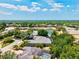 Aerial view featuring a community and pond, highlighting the real estate's desirable waterfront location at 12311 Newcastle Pl, Lakewood Ranch, FL 34202