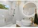 Modern bathroom featuring geometric wall tiles, vessel sink, and glass-enclosed shower, offering a contemporary feel at 12311 Newcastle Pl, Lakewood Ranch, FL 34202