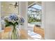 Breakfast nook with a view of the pool area and a table with a flower centerpiece at 12311 Newcastle Pl, Lakewood Ranch, FL 34202