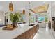 Spacious kitchen with an expansive island, state-of-the-art appliances, and open sightlines to the living room at 12311 Newcastle Pl, Lakewood Ranch, FL 34202