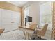 Functional office space featuring a wooden desk and a computer screen, providing a bright and efficient workspace at 12311 Newcastle Pl, Lakewood Ranch, FL 34202