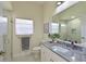 Bathroom vanity and large walk in shower with decorative tile and glass enclosure at 12811 Penguin Dr, Bradenton, FL 34212