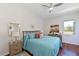 Cozy bedroom with hardwood floors and ample natural light from a bright window at 12811 Penguin Dr, Bradenton, FL 34212