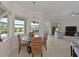 Bright dining area with large windows overlooking the pool and outdoor space at 12811 Penguin Dr, Bradenton, FL 34212