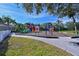 Community playground featuring colorful slides and play structures with a safe, cushioned ground cover at 12811 Penguin Dr, Bradenton, FL 34212