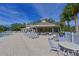 Resort-style community pool with comfortable lounge chairs and tables for relaxation and socializing at 12811 Penguin Dr, Bradenton, FL 34212