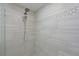 Walk in shower featuring designer tile and dual shower heads at 12811 Penguin Dr, Bradenton, FL 34212