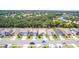 Aerial view of homes on a tree lined street within a well-maintained community at 141 Tierra Verde Way, Bradenton, FL 34212