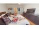 Spacious bedroom featuring a large bed, hardwood floors, and an en-suite bathroom at 141 Tierra Verde Way, Bradenton, FL 34212