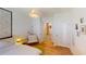 Light-filled bedroom with a modern lamp, and view to the hallway at 141 Tierra Verde Way, Bradenton, FL 34212
