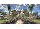 Beautiful community entrance with lush landscaping and brick walkway under sunny skies at 141 Tierra Verde Way, Bradenton, FL 34212