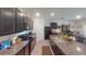 Modern kitchen features granite countertops, stainless steel appliances, and dark cabinetry at 141 Tierra Verde Way, Bradenton, FL 34212