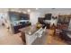 Open kitchen with dark cabinets, granite countertops, and an island with seating at 141 Tierra Verde Way, Bradenton, FL 34212