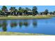 Picturesque pond with benches and landscaping providing a serene outdoor space at 141 Tierra Verde Way, Bradenton, FL 34212