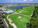 Aerial view of the golf course and lake within the community at 14214 Heritage Landing Blvd # 817, Punta Gorda, FL 33955
