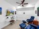 Bonus room with a ceiling fan, mounted tv, white trim and leather recliners at 14214 Heritage Landing Blvd # 817, Punta Gorda, FL 33955