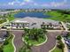 Aerial view of the clubhouse, showcasing the luxurious community amenities and landscaping at 14214 Heritage Landing Blvd # 817, Punta Gorda, FL 33955