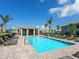 Resort-style pool with lounge chairs and a covered pavilion, perfect for relaxation and recreation at 14214 Heritage Landing Blvd # 817, Punta Gorda, FL 33955