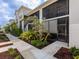 Beautiful condo featuring manicured landscaping, screened balcony, and private entrance at 14214 Heritage Landing Blvd # 817, Punta Gorda, FL 33955